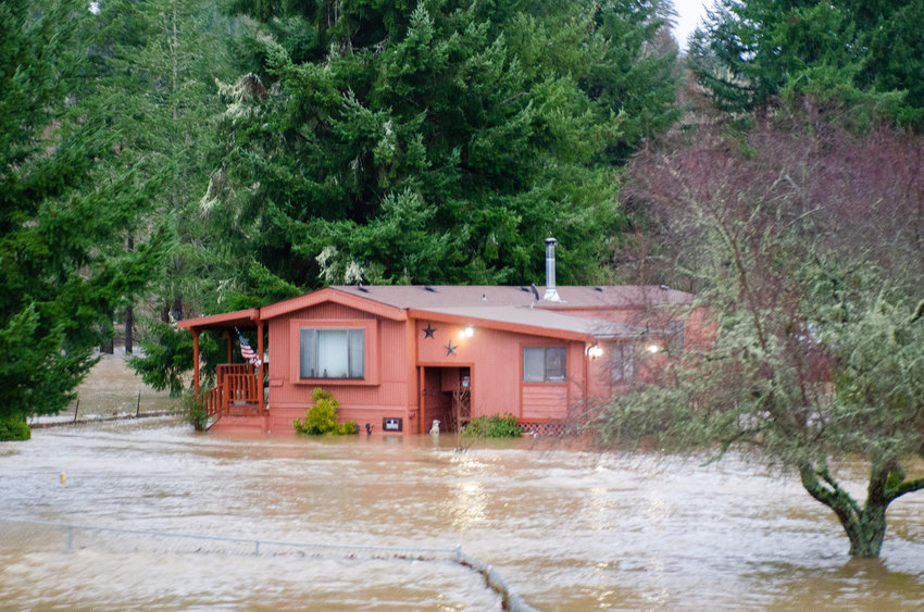 A home in Bucoda is seen surrounded by water Friday morning.