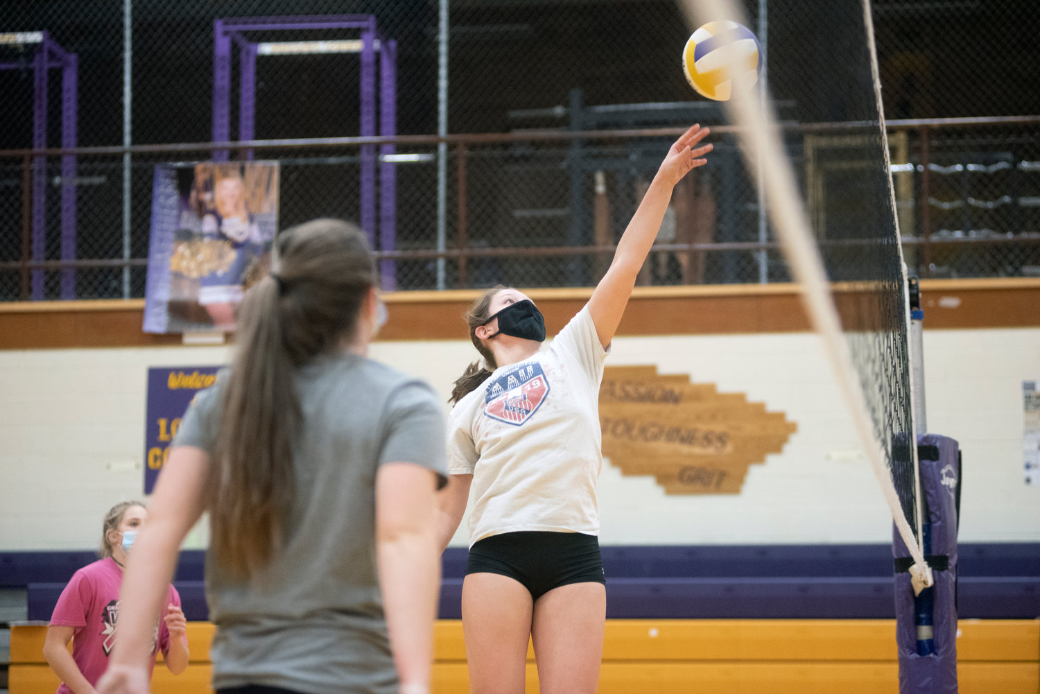 Onalaska junior Andi Oliver hits a ball at the net. Oliver transferred to Onalaska from a Class 4A school in Montana.