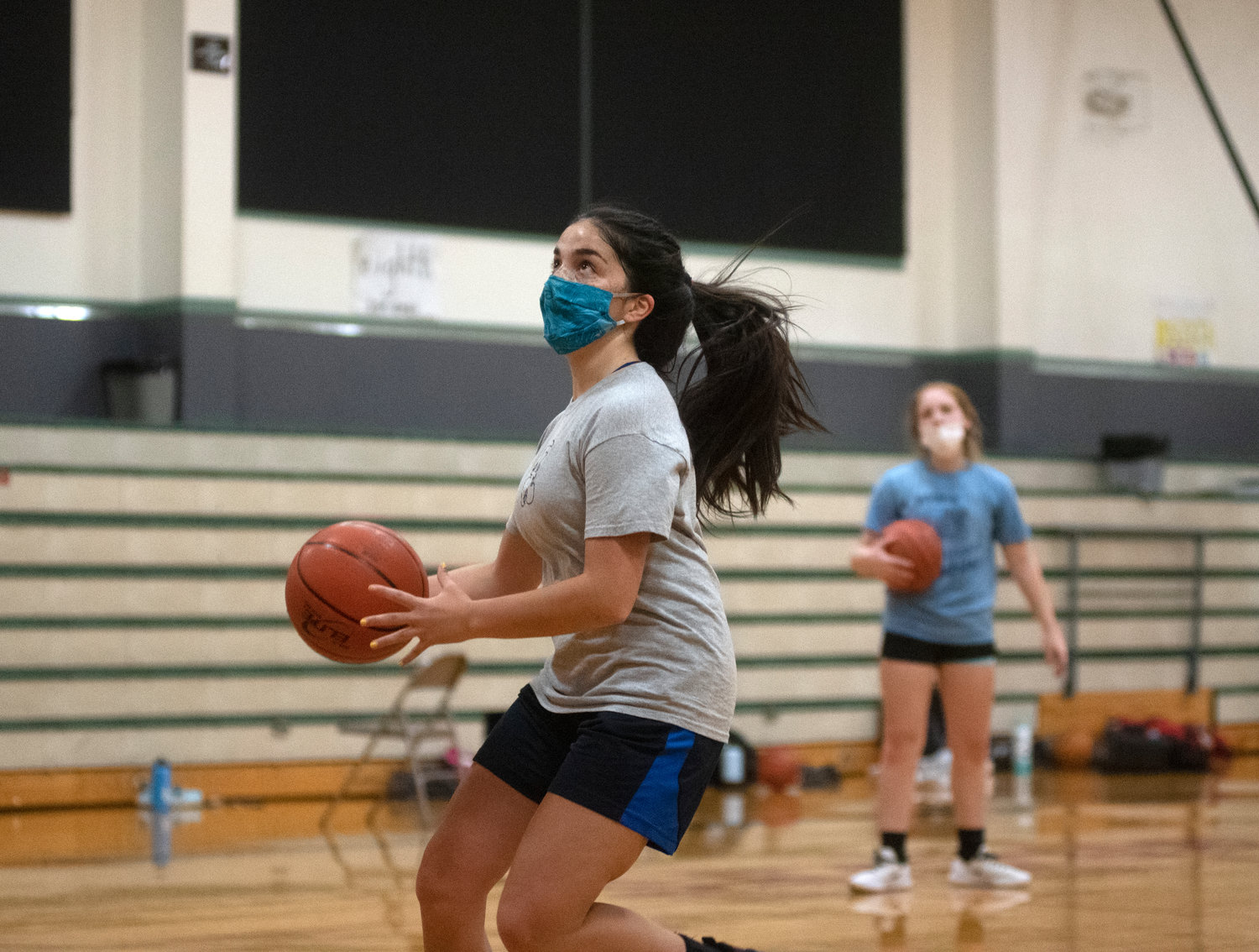 Senior guard Emma Cline-Maier drives for a layup during a drill at Tuesday’s practice.