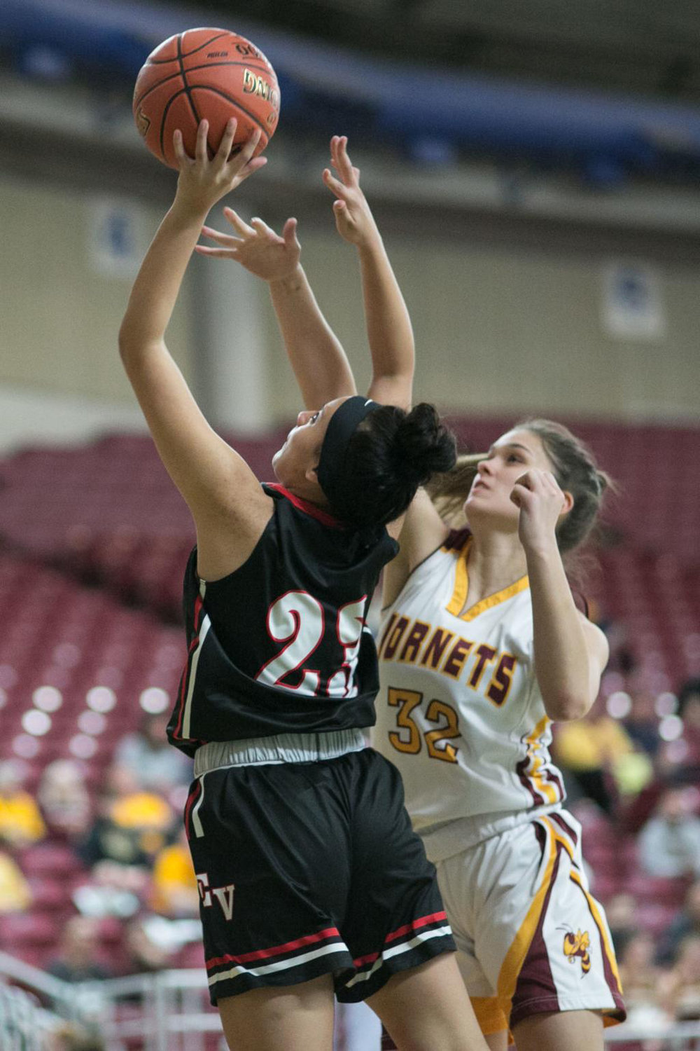 Sam Fiedler (32) defends an East Valley (Yakima) player during the Class 2A girls state basketball tournament in March. Fiedler pulled down five rebounds in the season-ending loss.