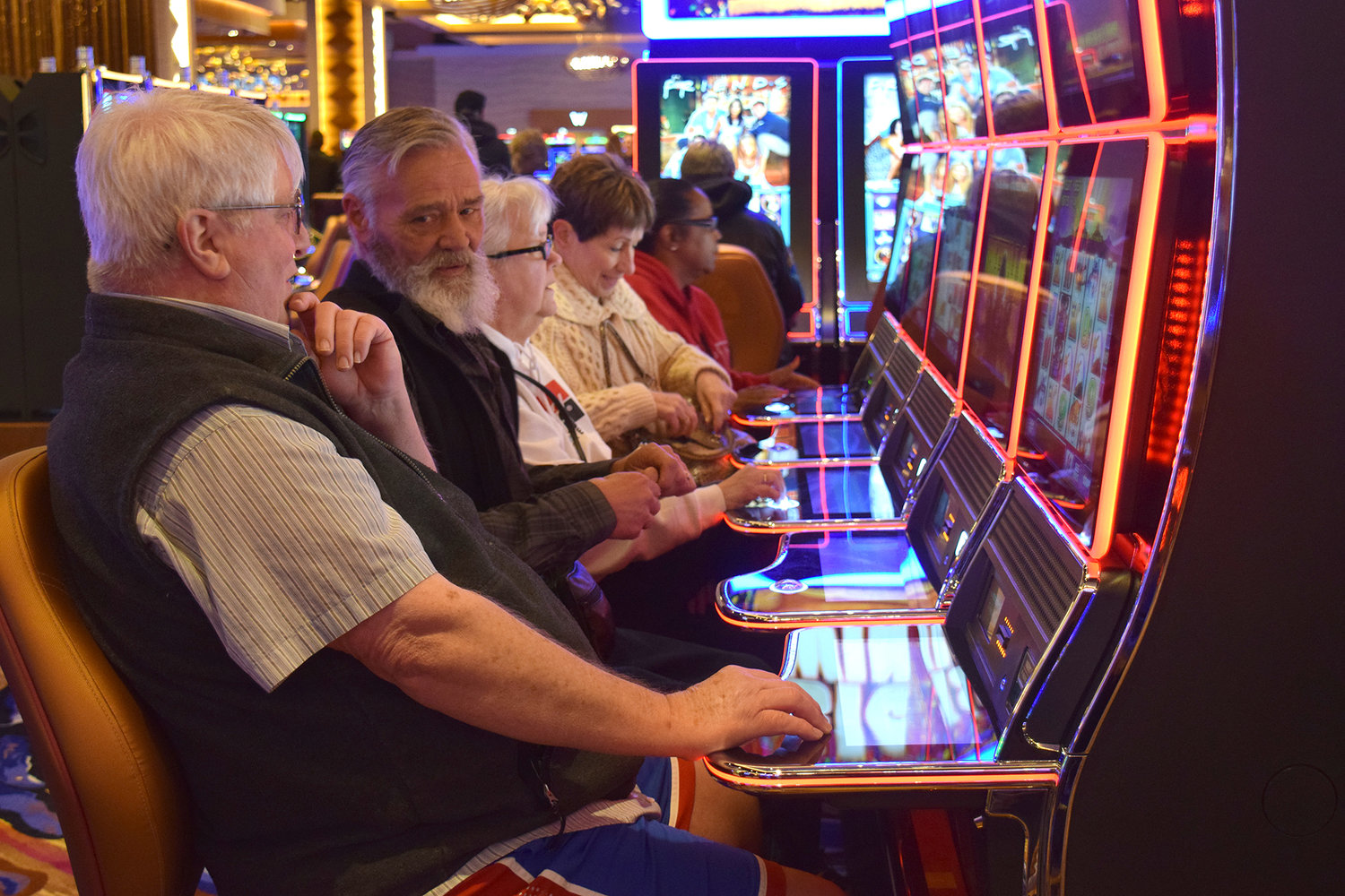 A group of visitors tries out a few of the 2,500 slot machines inside Ilani Casino in April 2017 in Ridgefield.