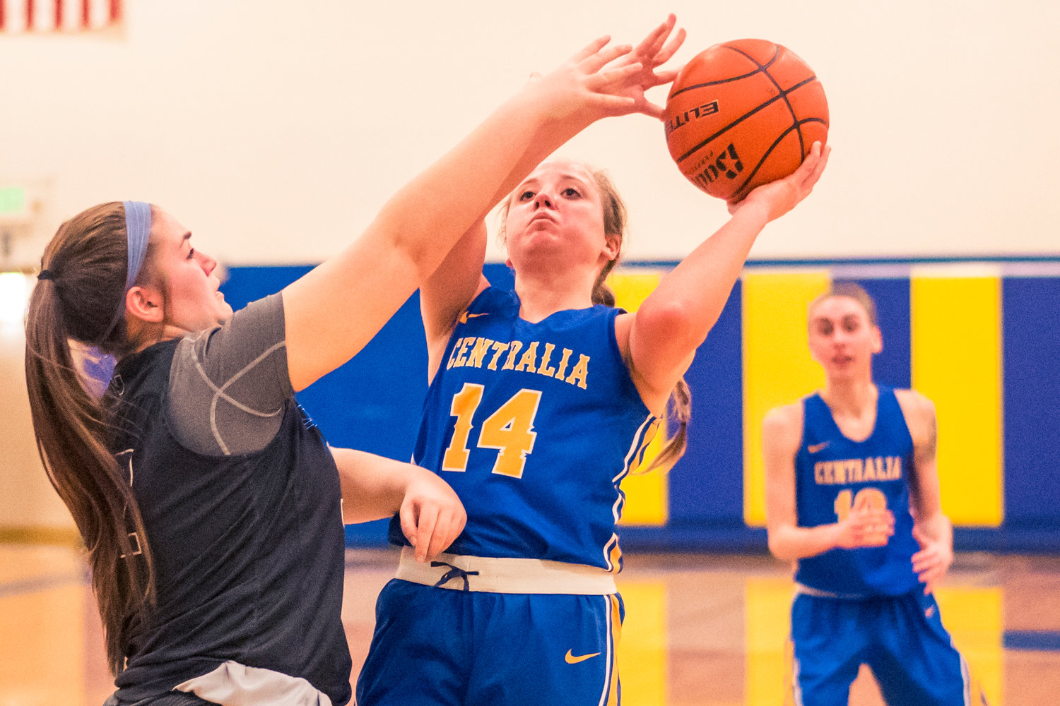 Centralia's Megan Cash (14) puts up a shot during a women's basketball game against S.P.S.C.C Wednesday night at Centralia College.