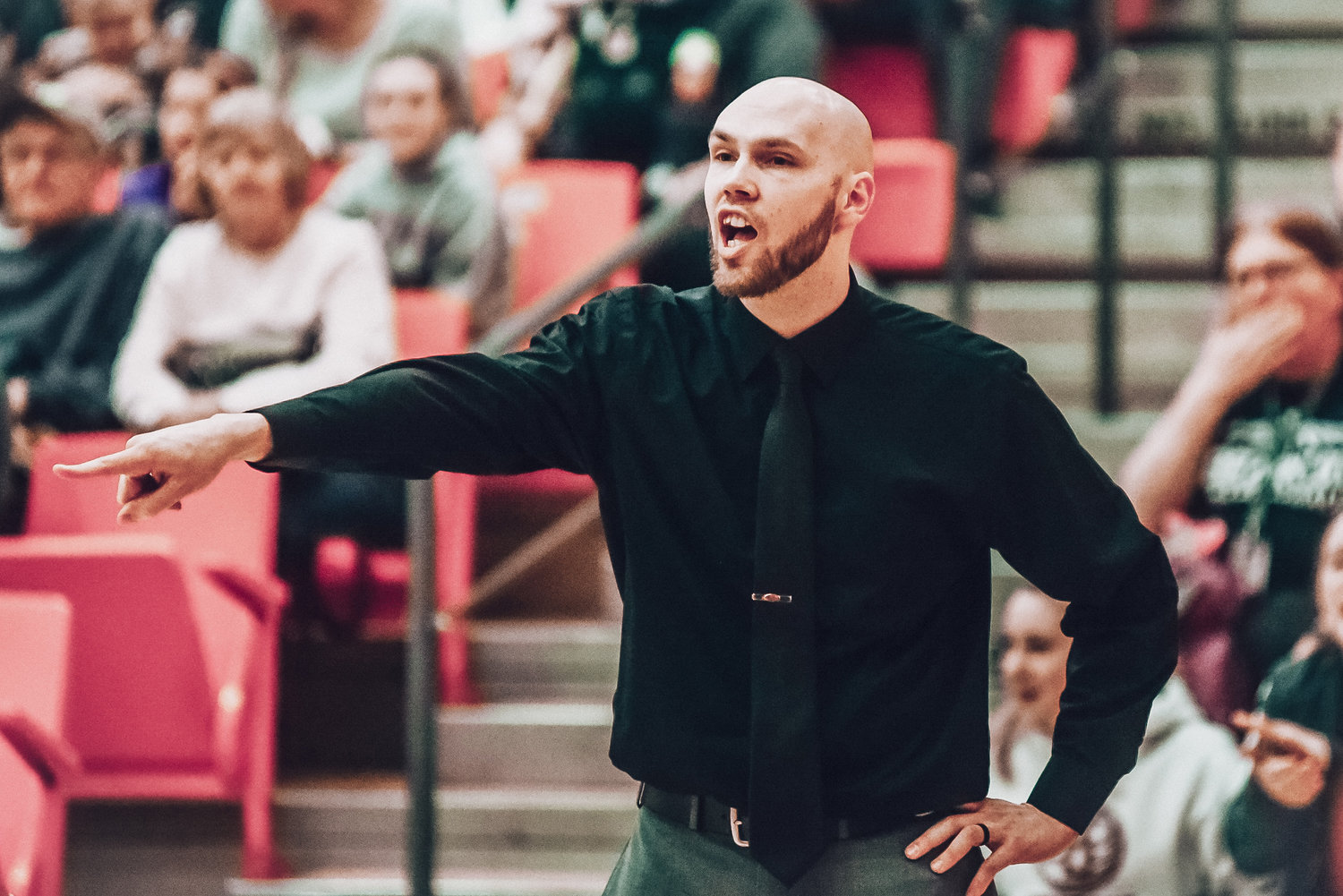 W.F. West coach Kyle Karnofski directs the Bearcats against Black Hills on Friday during the District 4 2A Girls Basketball Tournament championship game in Battle Ground.