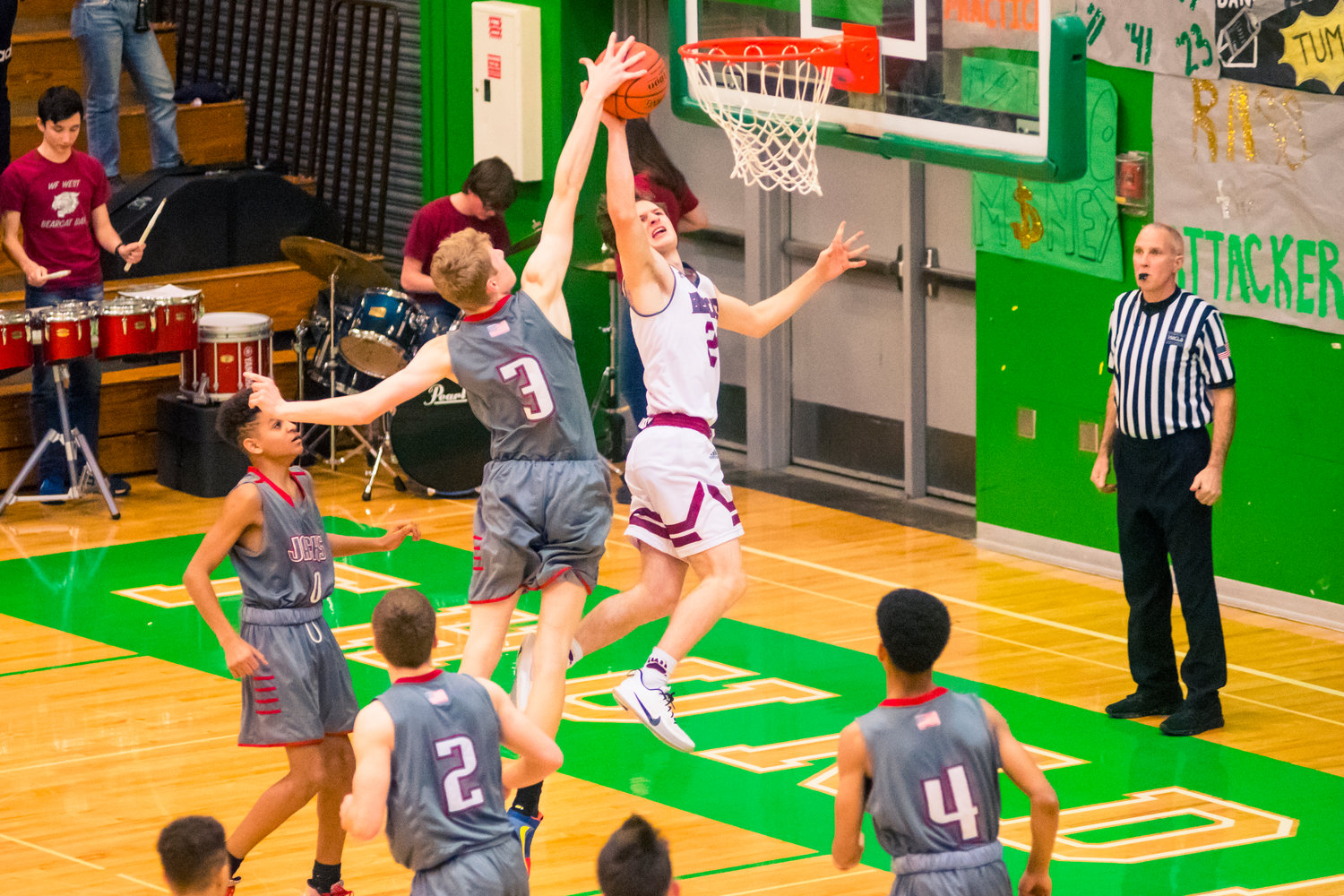 Images from a 2A District boys basketball game between R.A. Long and W.F. West played Thursday night at Tumwater High School.
