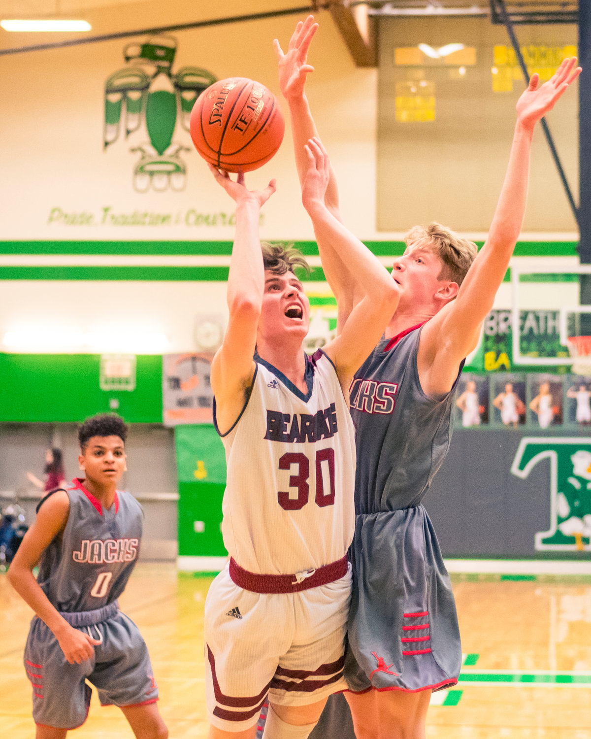 W.F. West's Tyler Speck (30) is shutdown on his way to the hoop during a game against Jacks Thursday night at Tumwater High School.