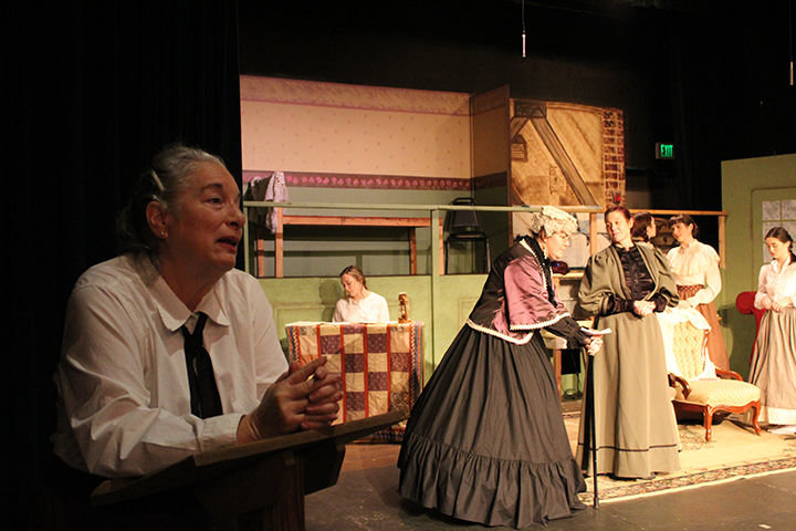 Elysa Ray as elder Jo, narrates the story of her life to a literary society in "Little Women" opening Feb. 14 at the Roxy. In this scene, she recalls a Christmas visit from the stern Aunt March (portrayed by Jessica Scogin) to the home of Mrs. March (portrayed by Kendra Heath) and her four daughters: Jo, portrayed by Scarlet Nixon Klein; Beth, portrayed by Kirsten Scogin; Meg, portrayed by Isabel Nixon Klein; and Amy, portrayed by Talia Heath
