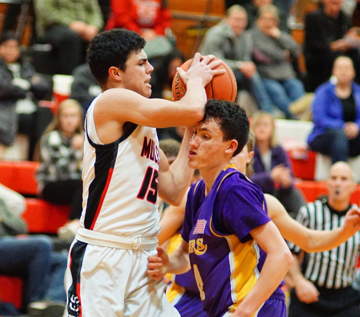 Wahkiakum's Dominic Curl pivots against defense from Onalaska's Carter Whitehead on Monday in Cathlamet.