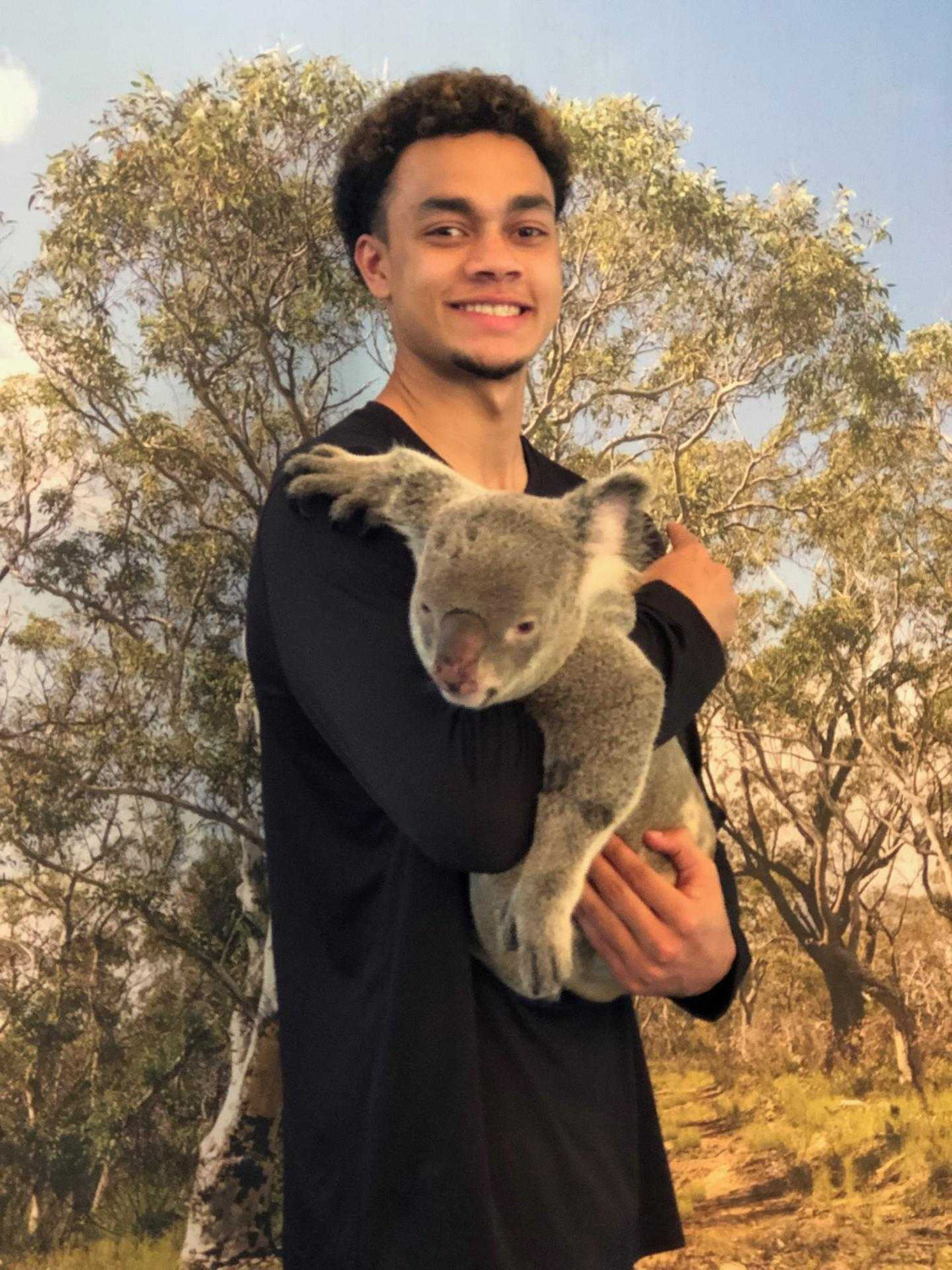 Jordan Thomas, a 2018 W.F. West High School graduate, poses with a koala bear on a trip to Australia he made last spring with the Pacific Lutheran University men's basketball team.