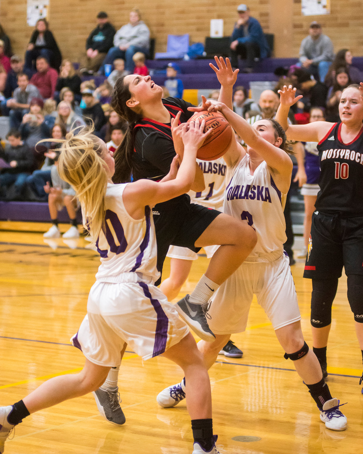 Viking's Andee Nelson (11) is fouled on her way up during a Central 2B girls basketball game Thursday night in Onalaska.