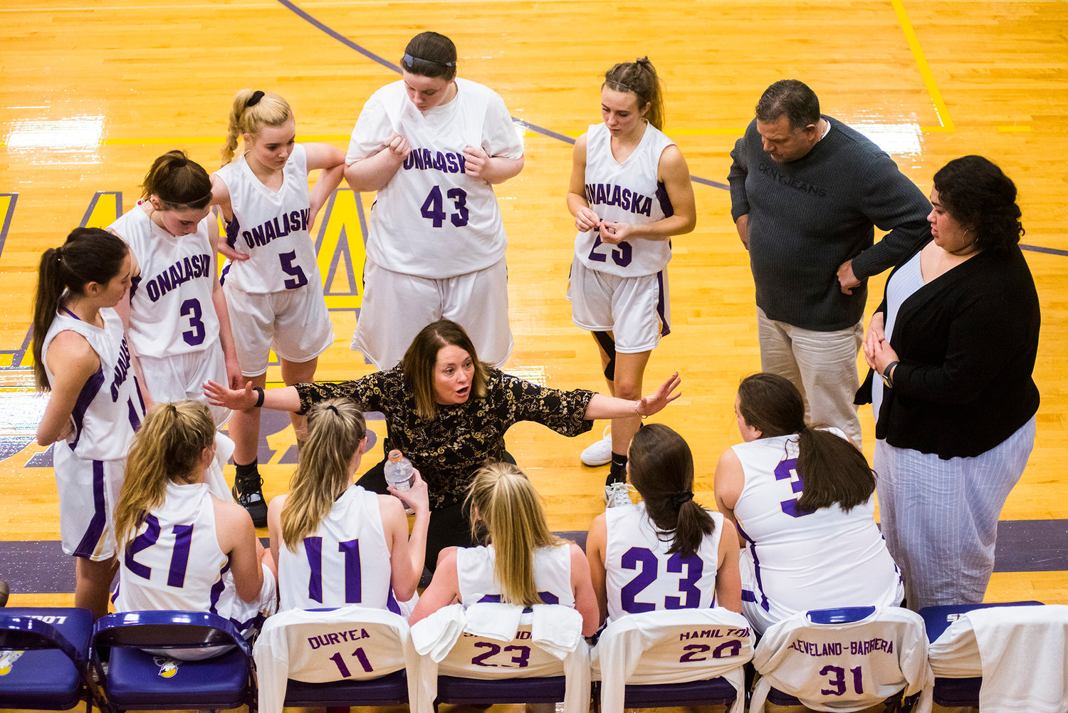 Onalaska coach Dracy McCoy talks with her players during a Central 2B girls basketball game against Mossyrock Thursday night in Onalaska.