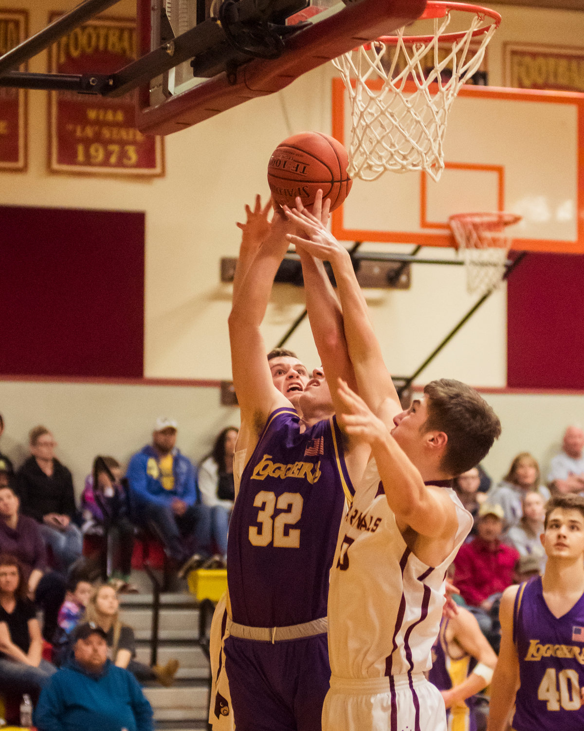 Onalaska's Ashton Haight (32) is surrounded by Cardinal defenders as he goes up for a shot Wednesday night at Winlock High School.