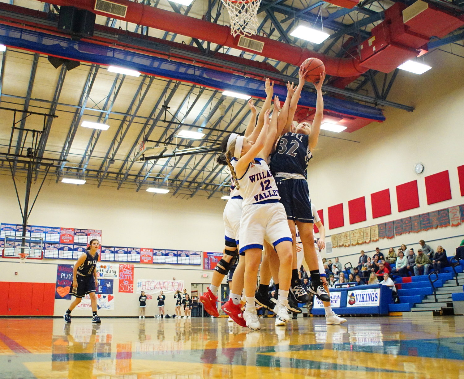 Trojan's Charlie Carper (32) snags a rebound during a game against Willapa Valley Thursday night in Menlo.