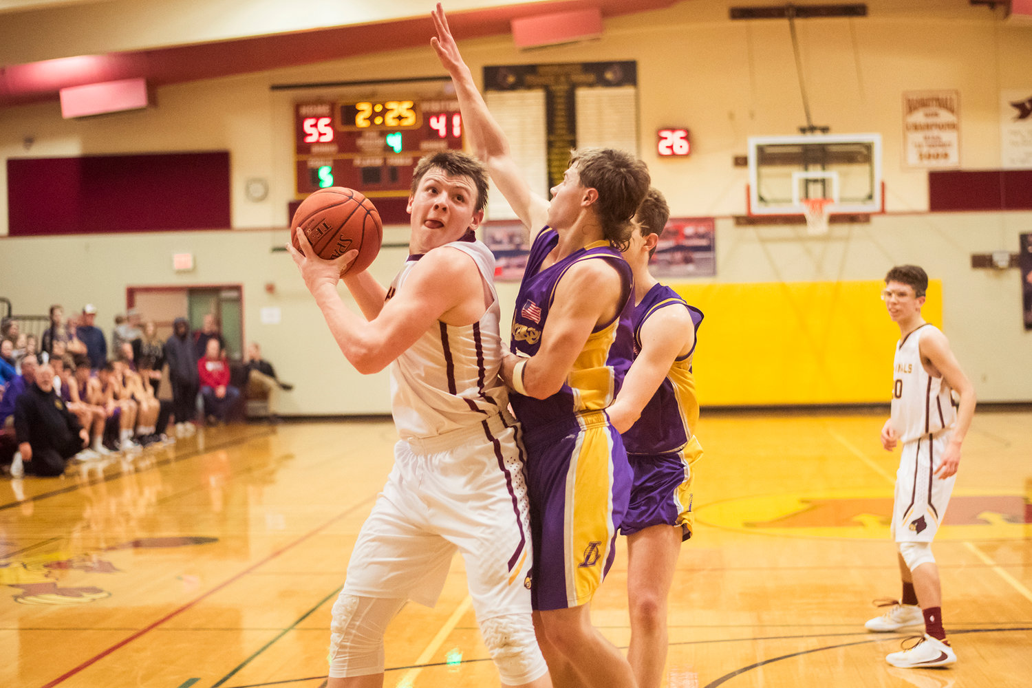Cardinal's Nolan Swofford (31) looks to the basket before driving in Wednesday night at Winlock High School.