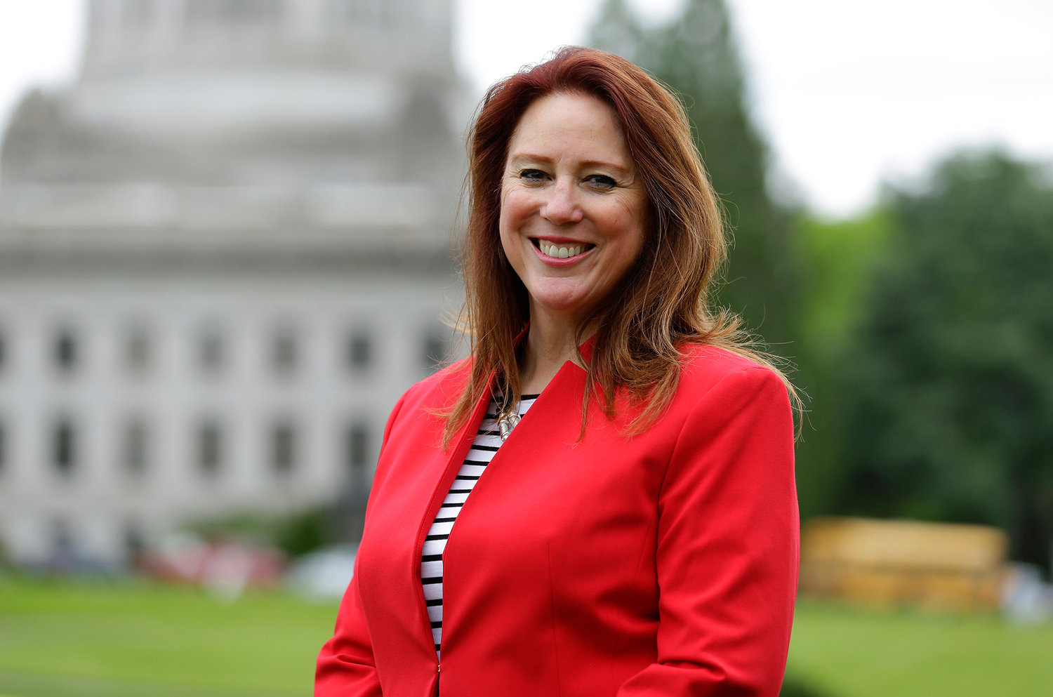 In this May 4, 2016 photo, Washington Secretary of State Kim Wyman poses for a photo at the Capitol in Olympia,