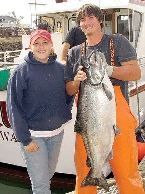Buddy Rose / The Chronicle Deckhand Colin Vasereno hoists a big chinook salmon caught by Megan Shunkwiler, from Olympia, this week at Westport. Shunkwiler was fishing on Gold Rush, a Westport Charters boat captained by Kevin Vasereno, her former teacher at Black Hills High School in Tumwater. The monster tipped the scales at 28 pounds 12 ounces, dressed weight, which turned out to be the biggest salmon of the day in the ongoing Westport Charterboat Association Derby. For her efforts, Megan took home a derby winner check for $500.