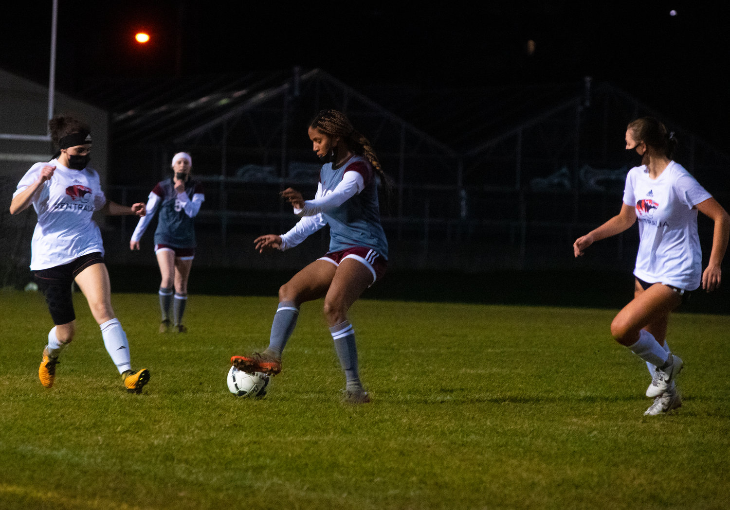 W.F. West's Tizzie Zylstra, middle, keeps the ball away from Centralia defenders on Tuesday.