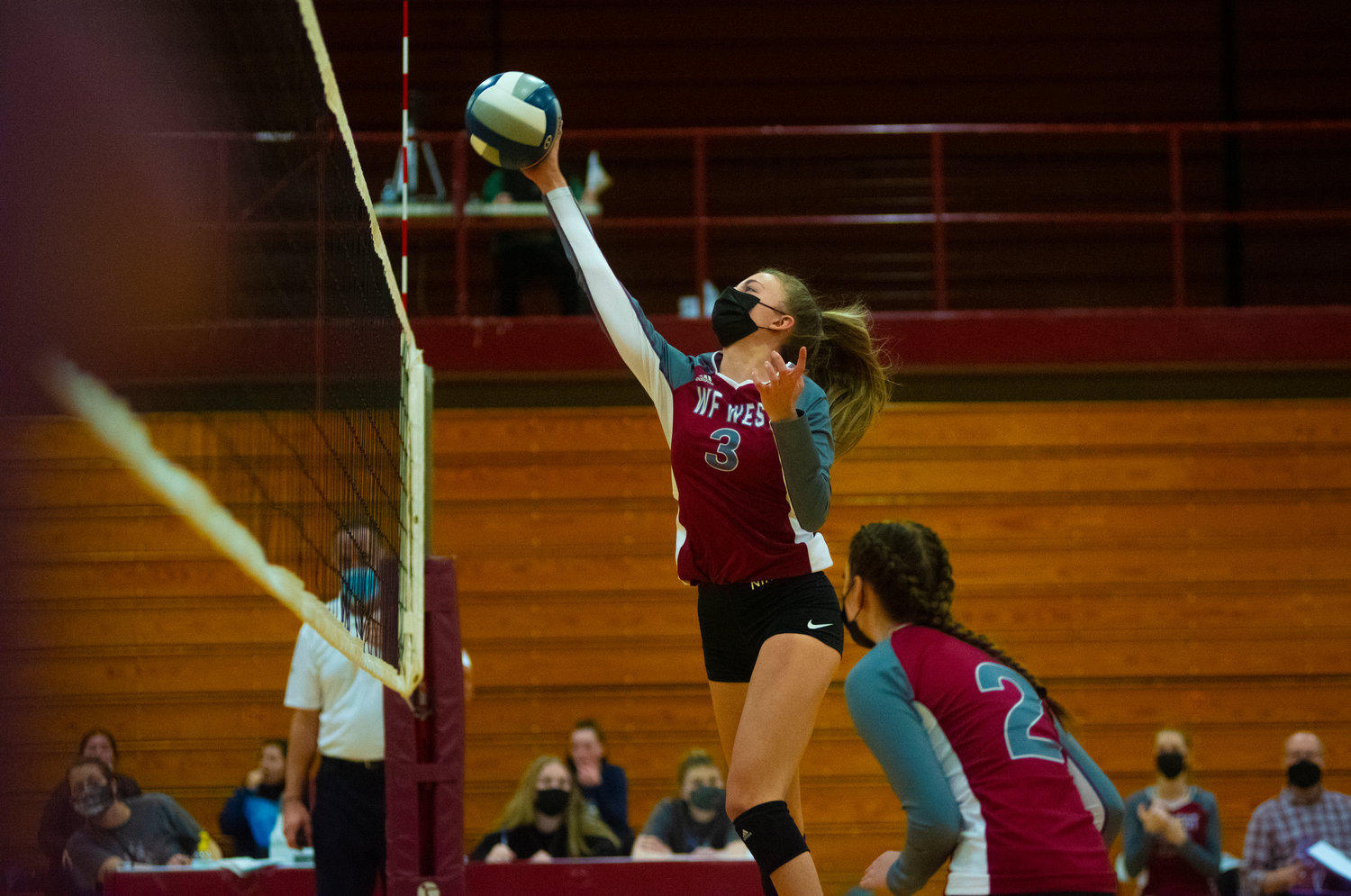 W.F. West's Amelia Etue sends the ball back over the net against Aberdeen Thursday.