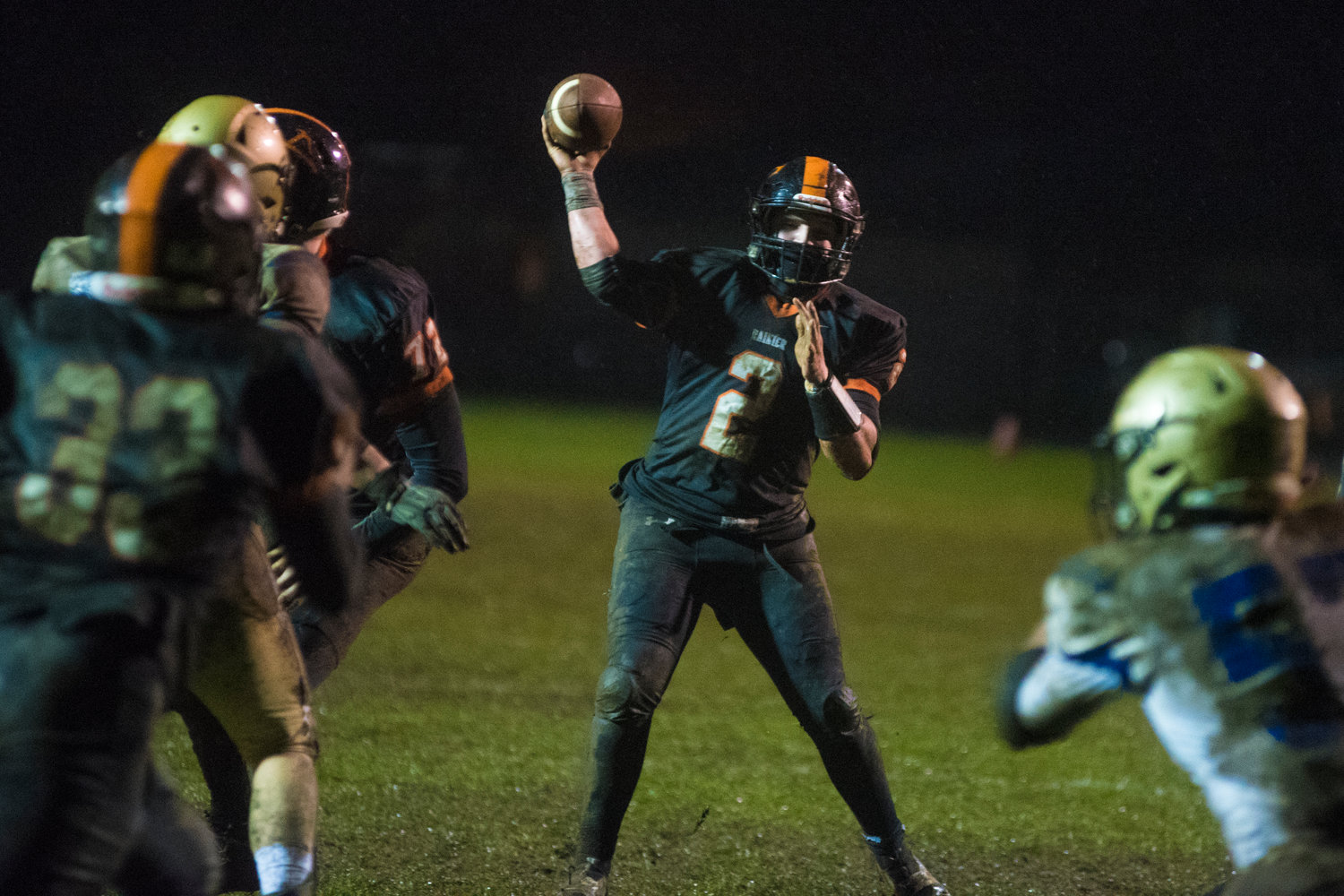 FILE PHOTO - Rainier quarterback Mike Green winds up for a pass in the redzone against Adna earlier this season.