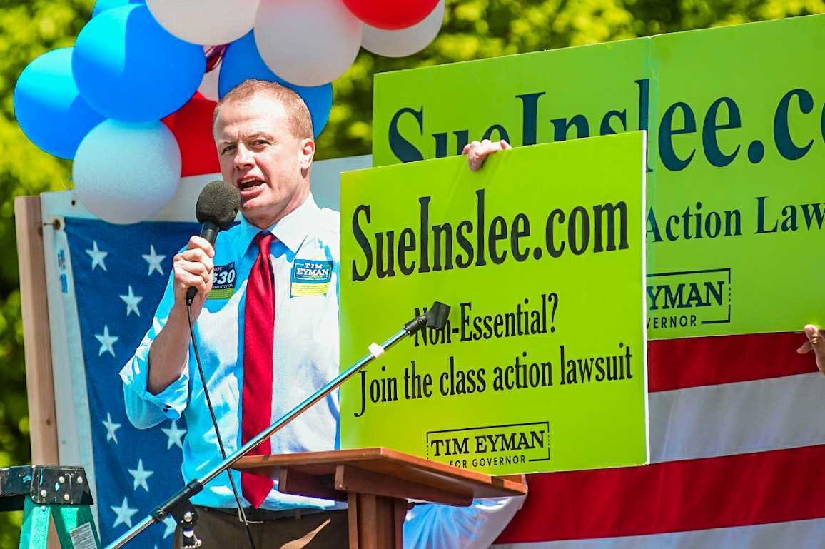 Tim Eyman addresses a crowd during a protest at the Capitol in early May.  