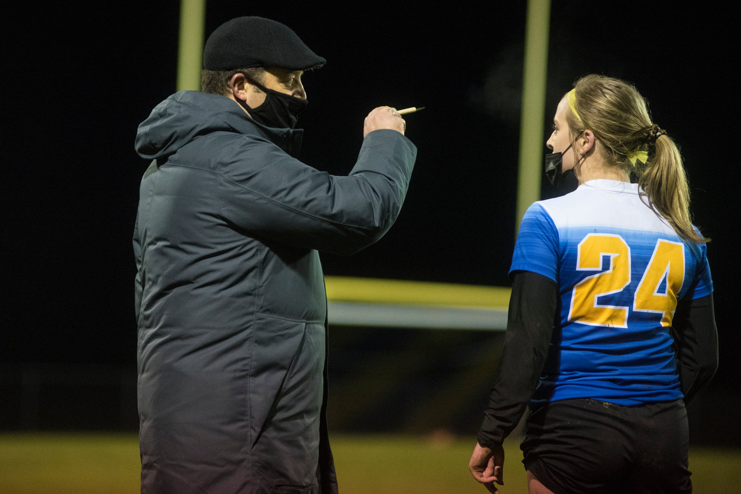 Adna coach Horst Malunat, in his first year with the Pirates, goes over a mid-game plan with Macy Kalnoski.