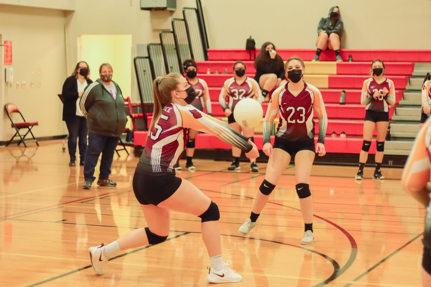 Cardinal's Addison Hall (25) makes contact during a volleyball game in Winlock on Tuesday.