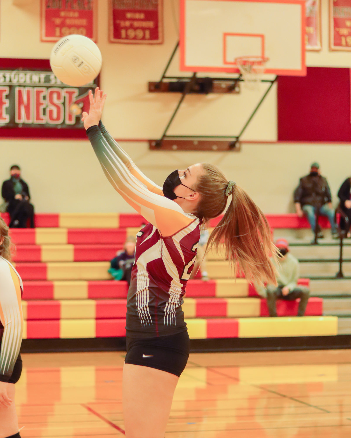 Cardinal's Addison Hall (25) makes contact during a volleyball game in Winlock on Tuesday.