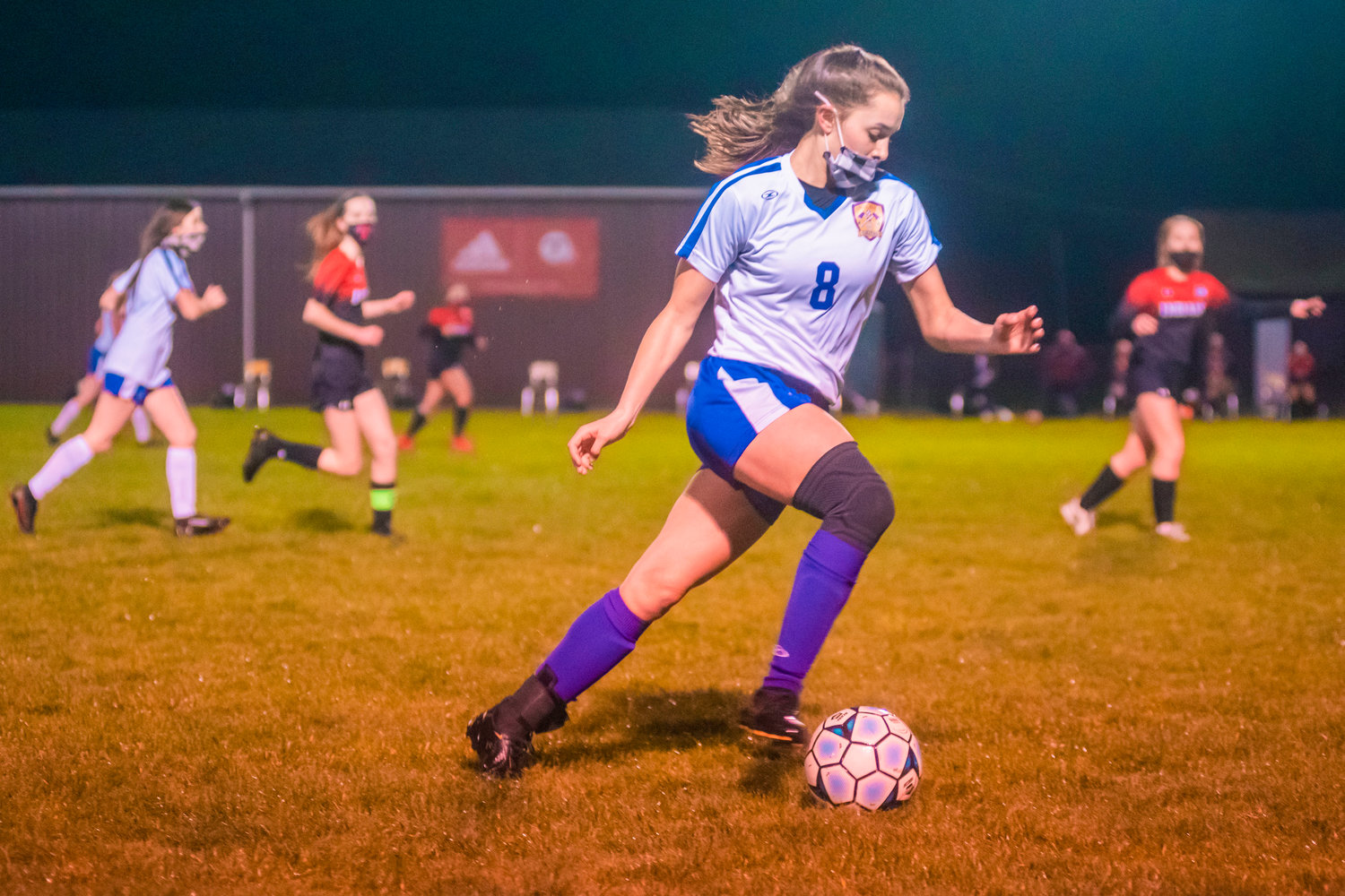 Onalaska’s Brooklyn Sandridge (8) takes the ball down the field during a soccer game Monday night in Toledo.