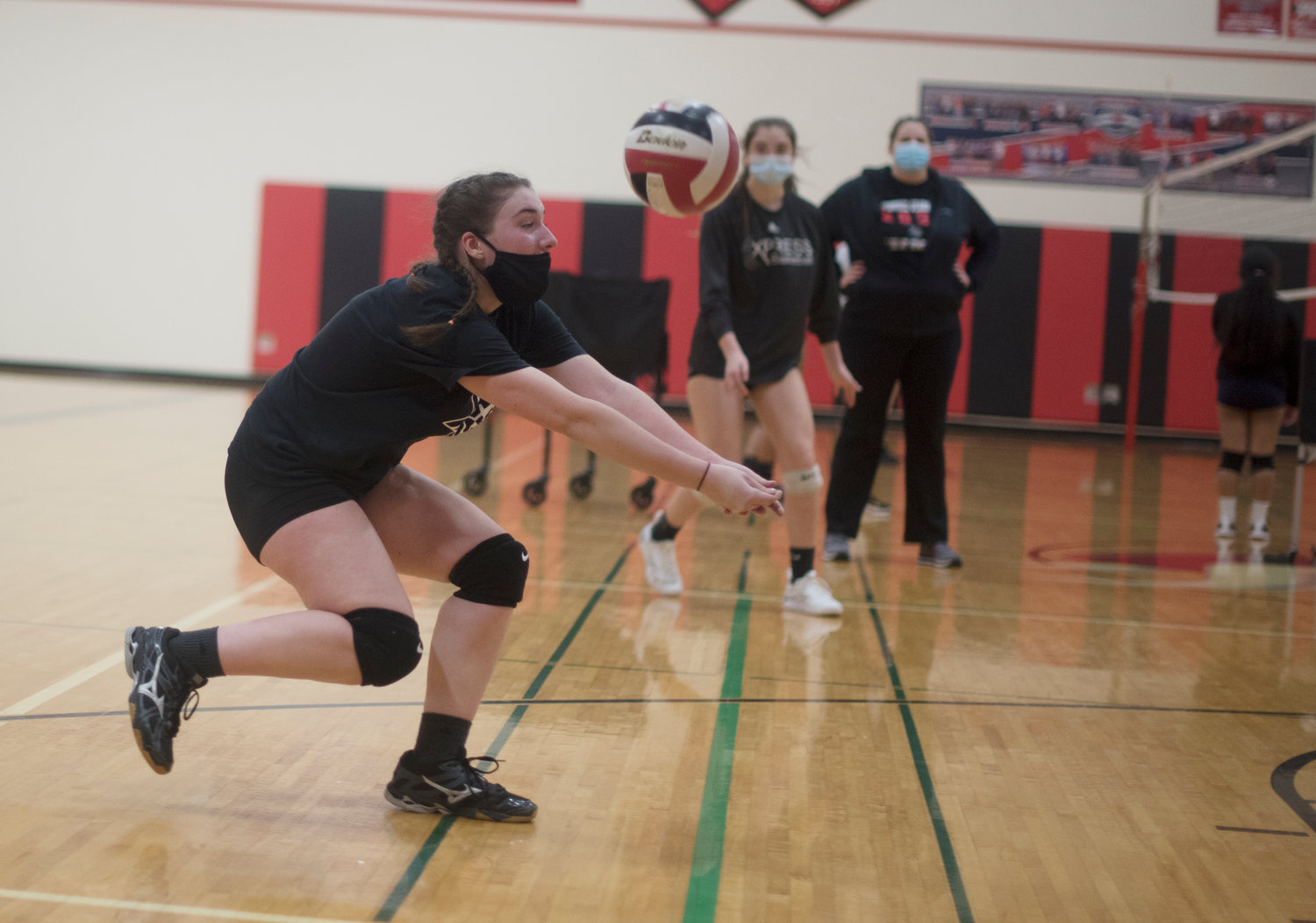Mossyrock senior Caelynn Marshall makes a dig during practice on Monday, Feb. 1, 2021.