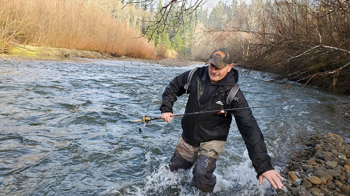 Ray Hawks, an enrolled Quinault Indian Nation member, fords the Salmon River on the Olympic Peninsula on Sunday, Jan. 17.