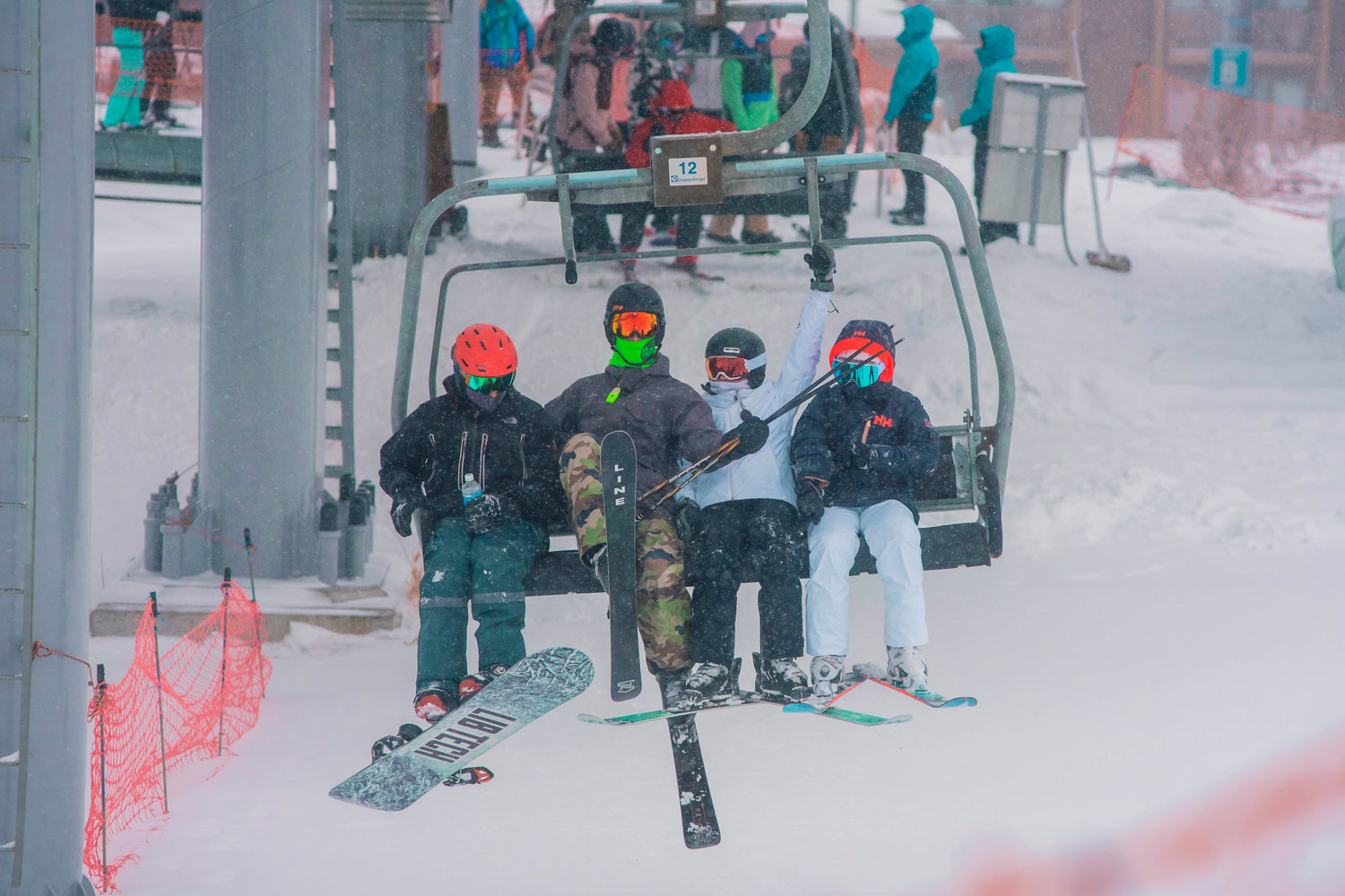 Skiers and snowboarders ride ‘The Great White Express’ at White Pass on Sunday.