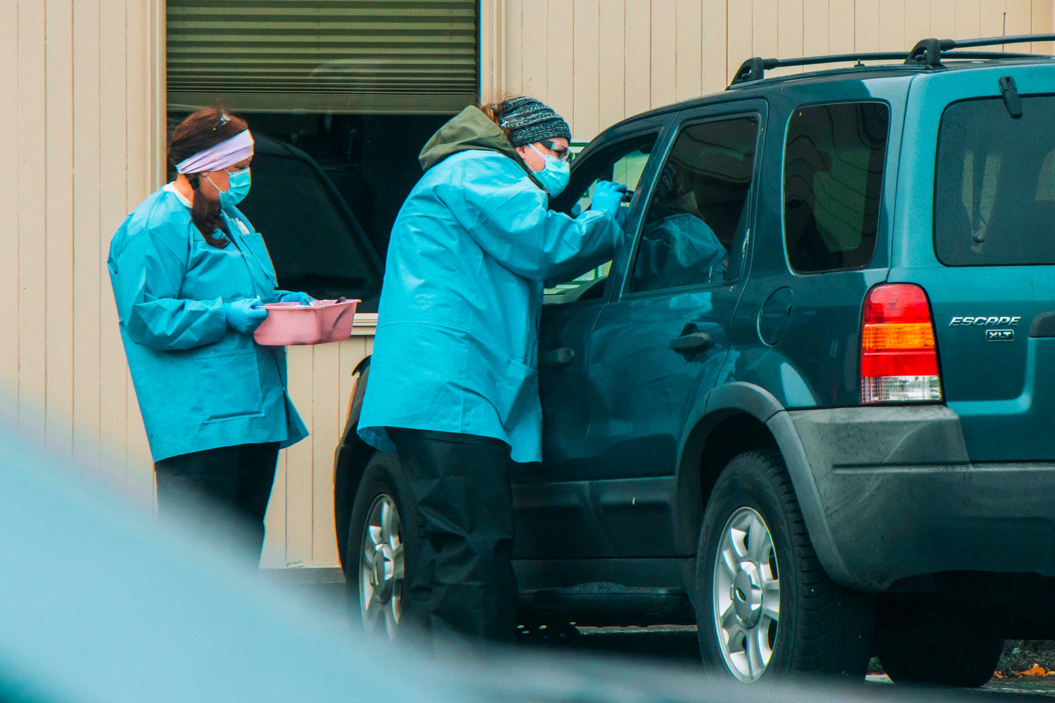 Medical personnel at Valley View Health Center examine a patient at a drive up COVID-19 testing site last year.