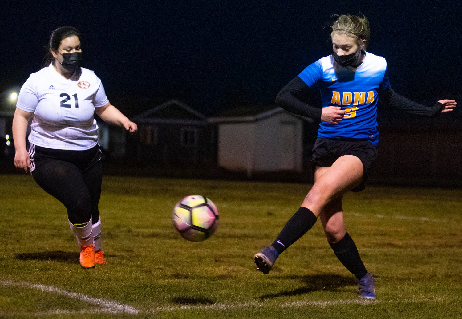 Adna's Kaylin Todd (9) boots the ball away from Napavine's Liliana Marcial (21) during a match on Wednesday.