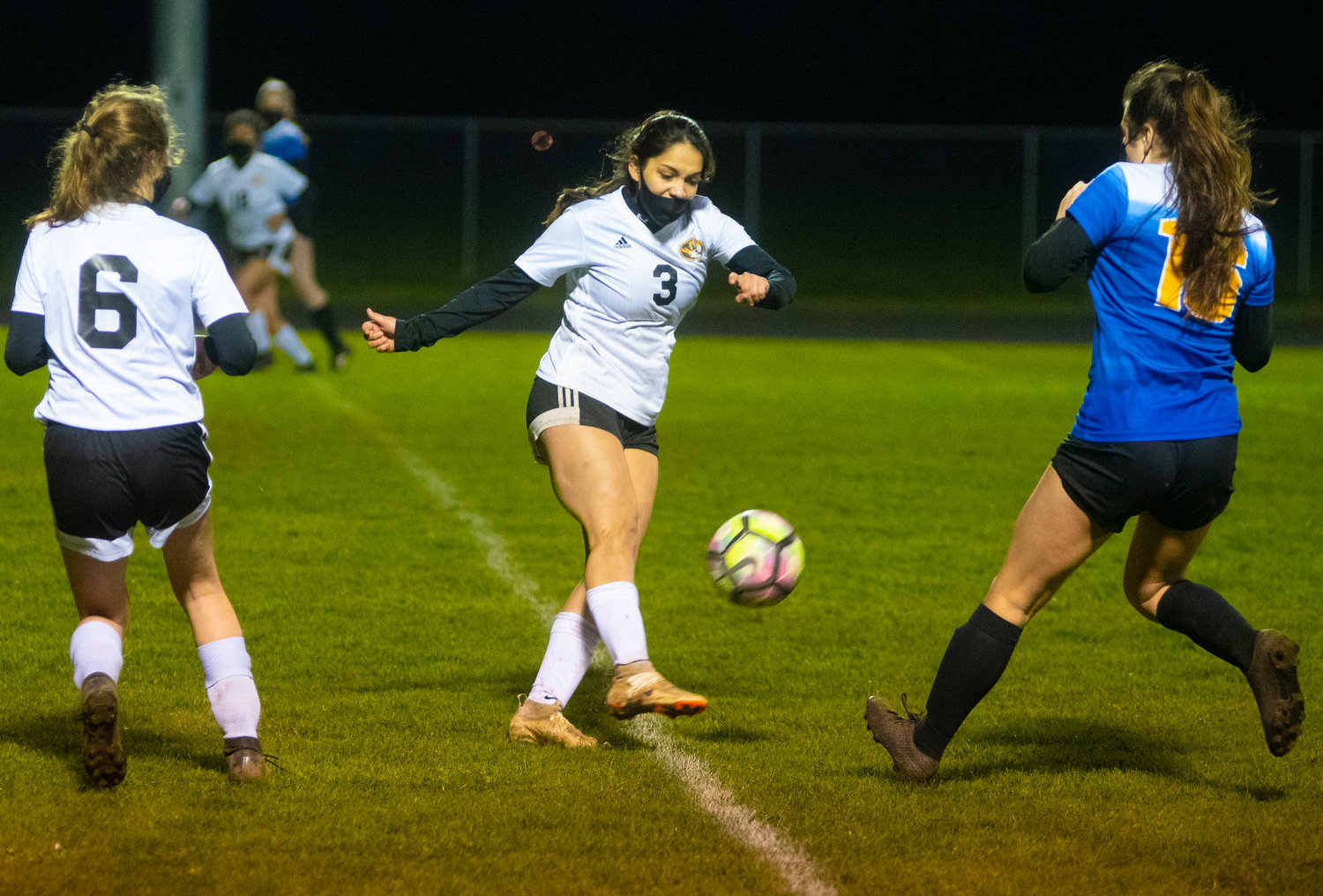 Napavine's Natalya Marcial (3) boots the ball downfield while Adna's Zarine Walker (16) tries to stop the kick.