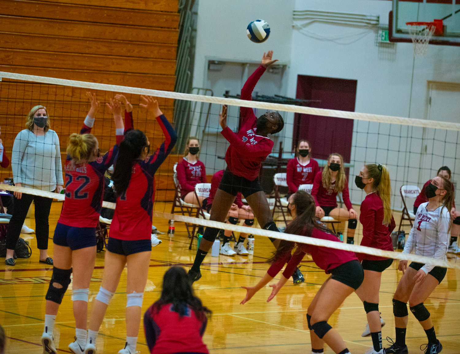 W.F. West's Miriama Ceesay (12) spikes the ball against Black Hills on Tuesday.