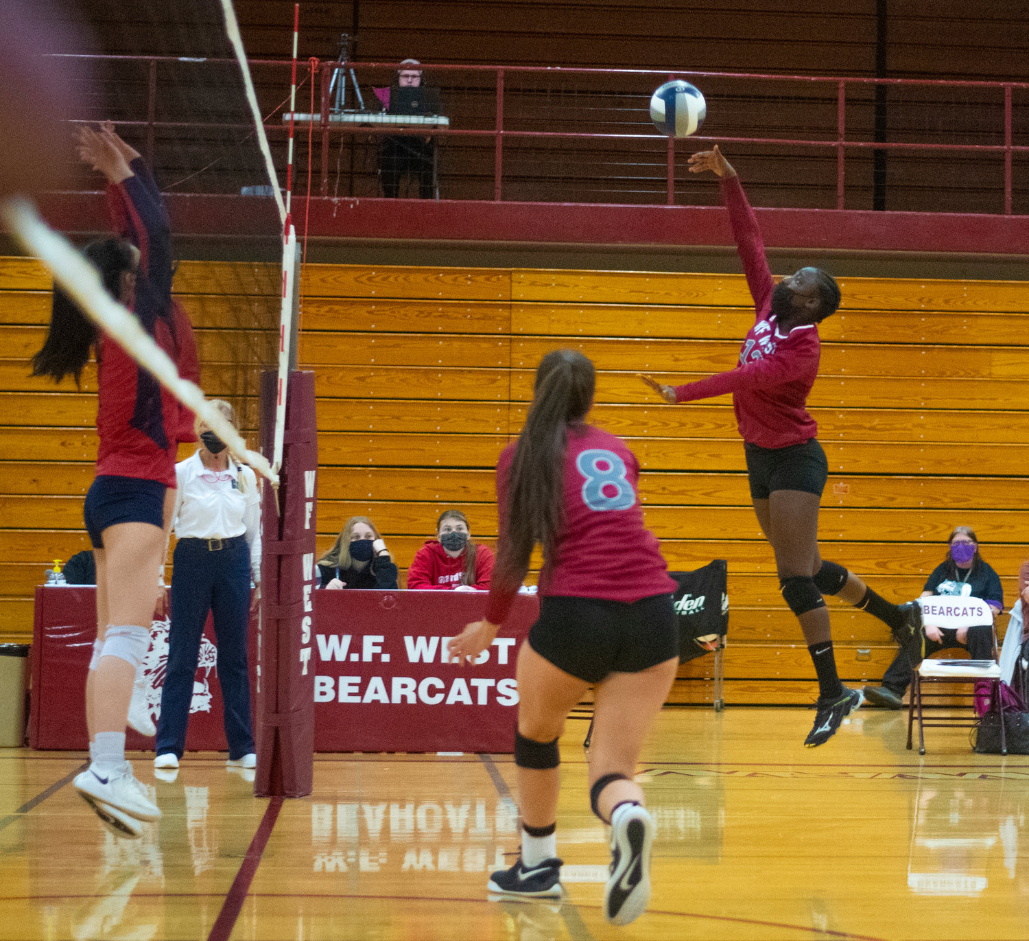 W.F. West's Miriama Ceesay spikes the ball against Black Hills.