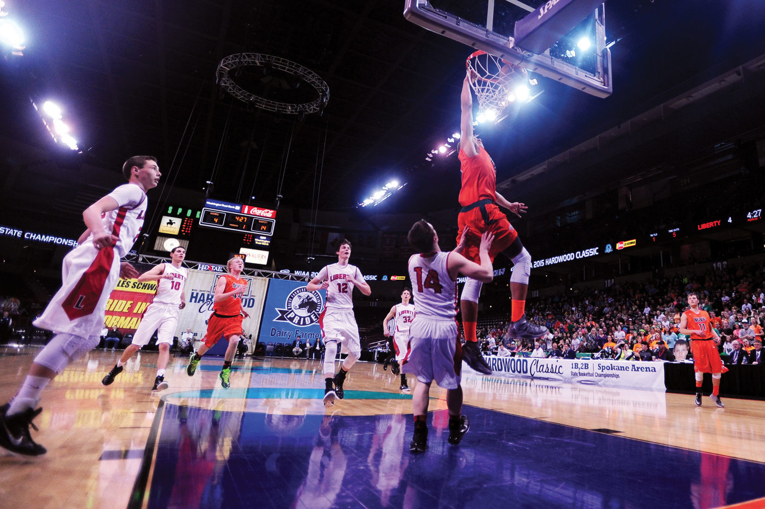 FILE PHOTO — Morton-White Pass's Zach Walton dunks over Liberty's Tyler Haas during the first quarter of a State 2B Boys Basketball Tournament Championship Game at the Spokane Arena in 2015.