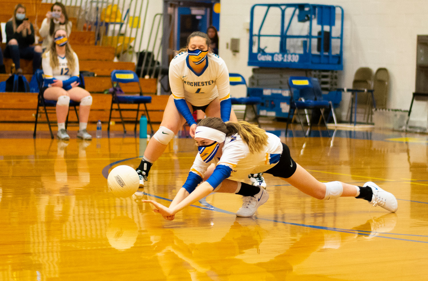 Rochester's Emily Holmes-Pickernell dives for a Centralia serve on Thursday.