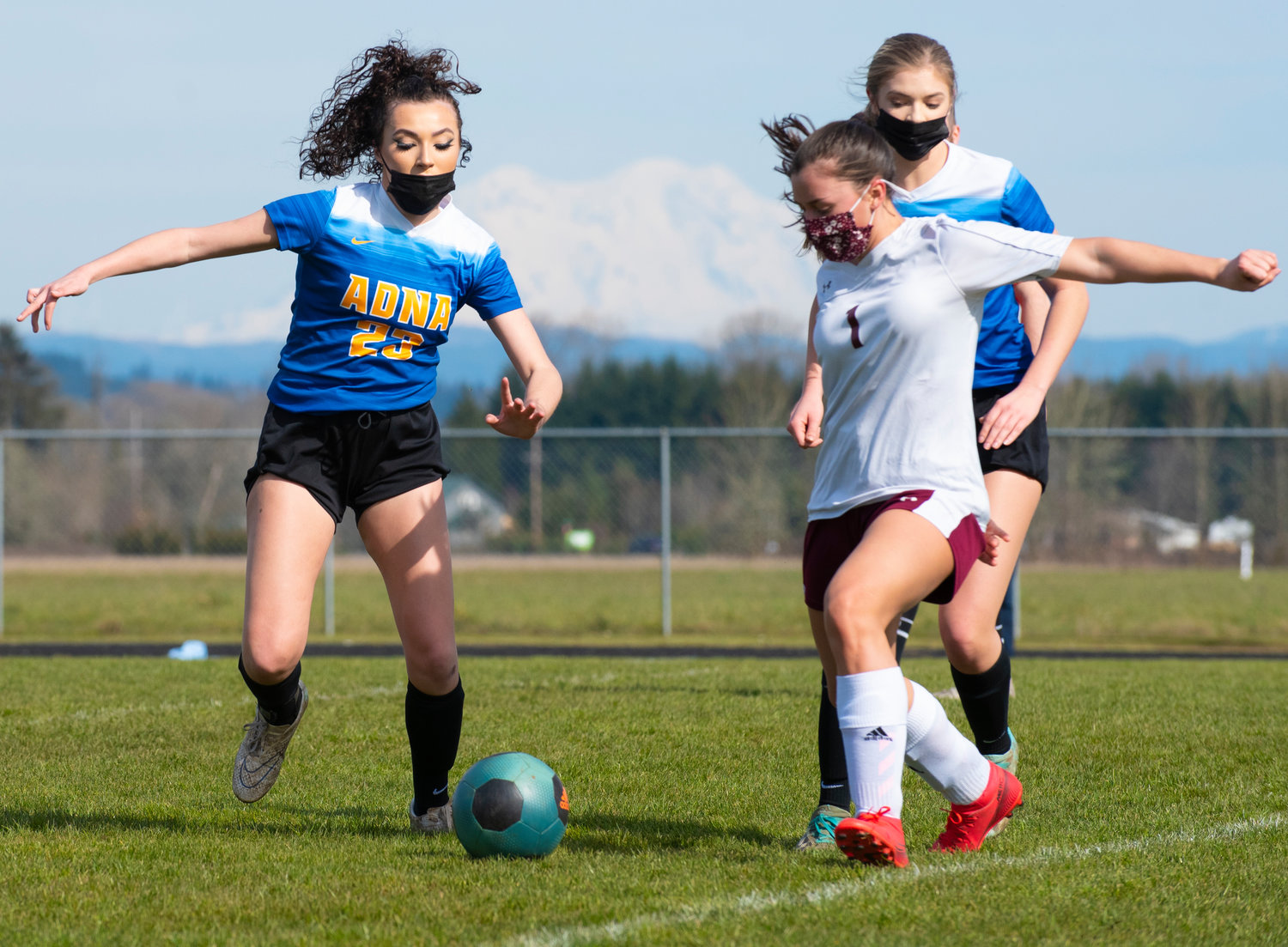 Adna's Presley Smith (23) races for the ball against a Stevenson defender on Saturday.