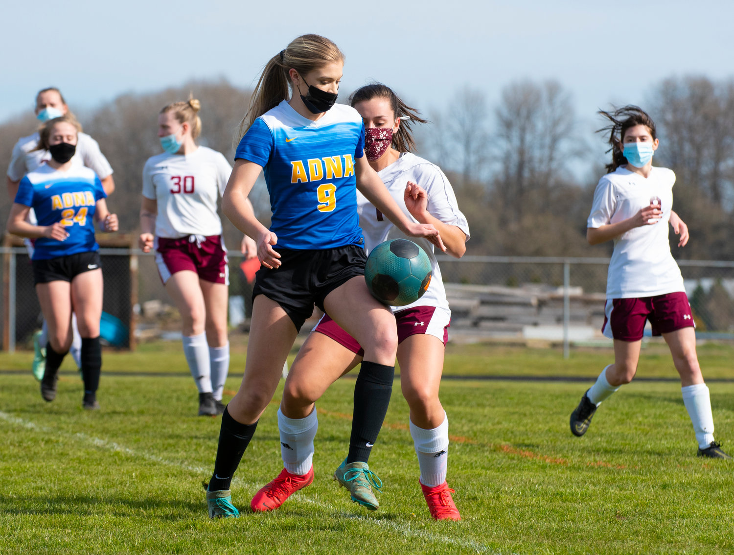 Adna's Kaylinn Todd (9) battles with a Stevenson defender near the Bulldogs' goal during the opening round of the playoffs on Saturday at home.