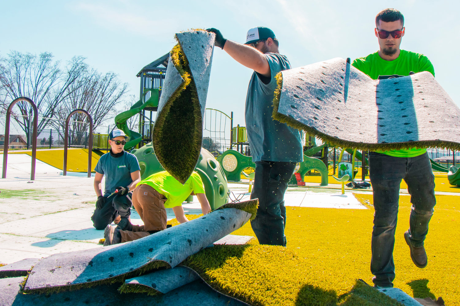 Crews with ForeverLawn mention being ‘bummed’ while working to replace damaged turf within Penny Playground in Chehalis on Friday.