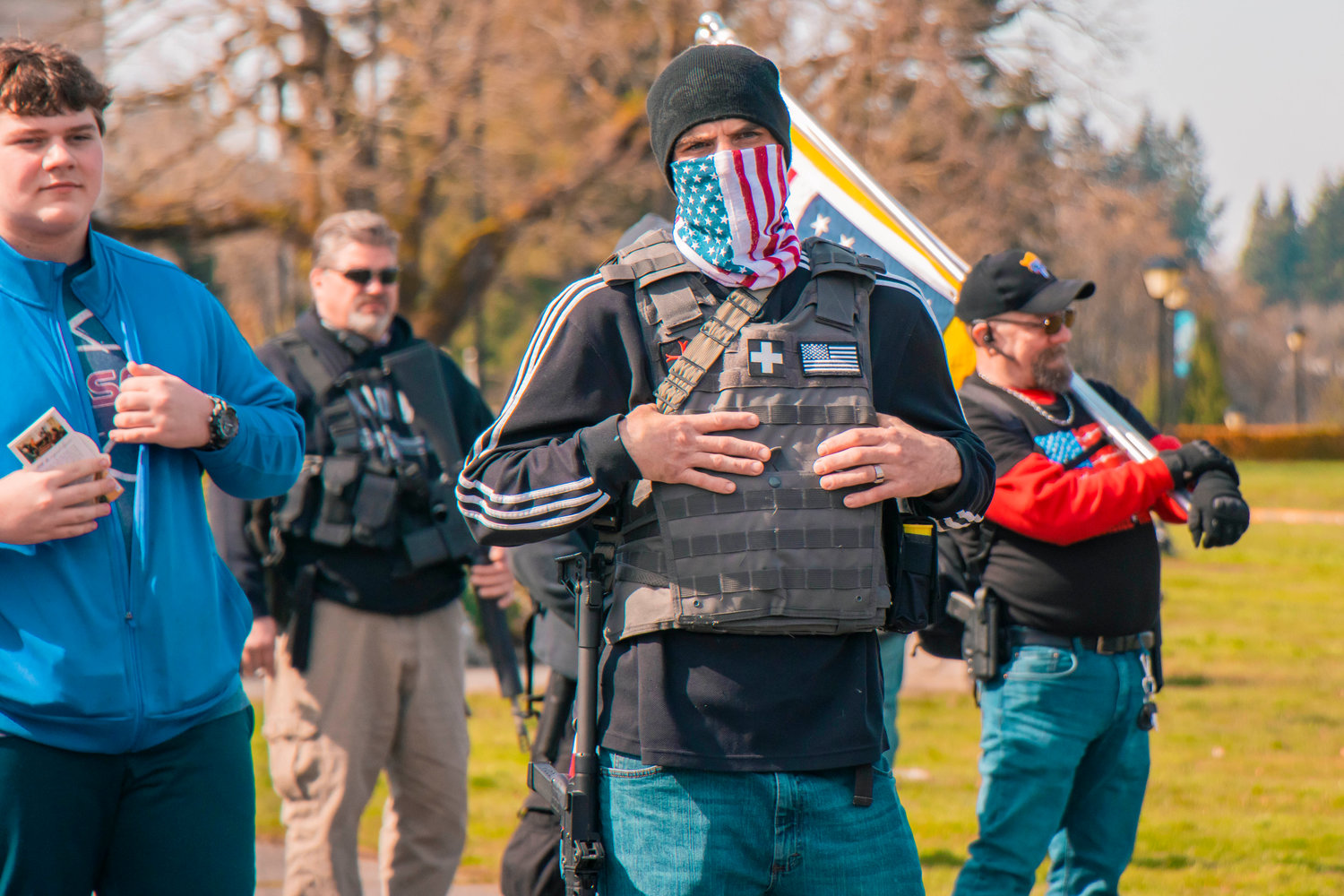 A protester sports an American flag mask during a rally in support of open carry in Olympia on Saturday.