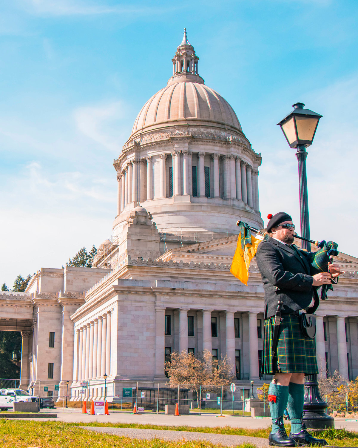 A bagpipe player blows into his instrument outside the Washington State Capitol Saturday afternoon in Olympia.