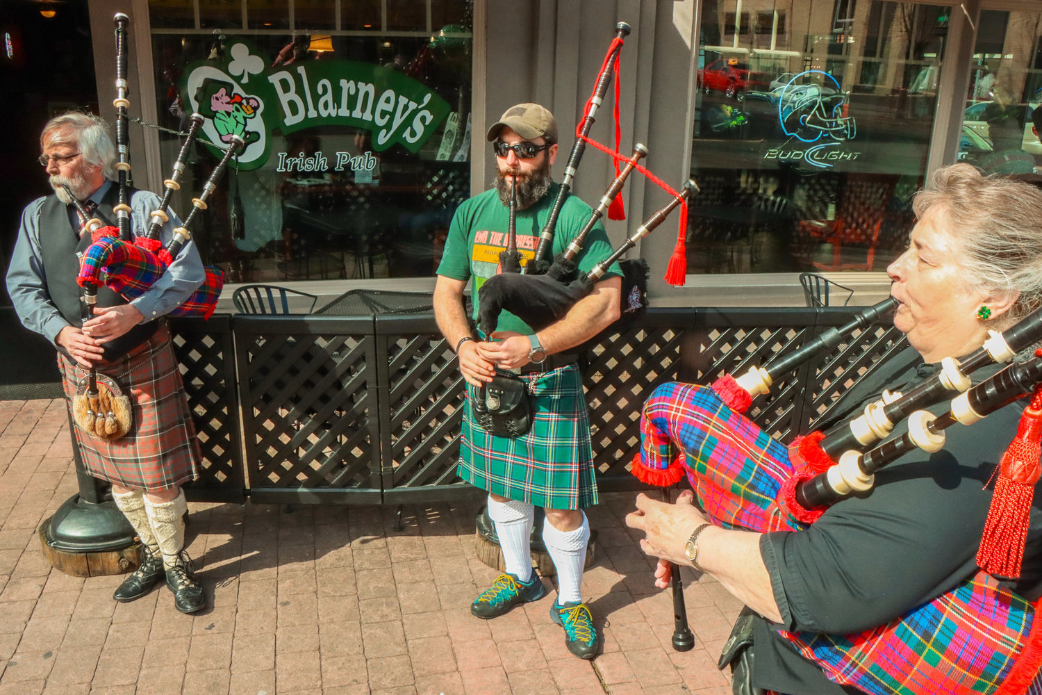 From left to right, Colin Gemmell, Aaron Amick, and Beverly York play bagpipes outside of O'Blarney's Irish Pub on St. Patrick's Day in Centralia.