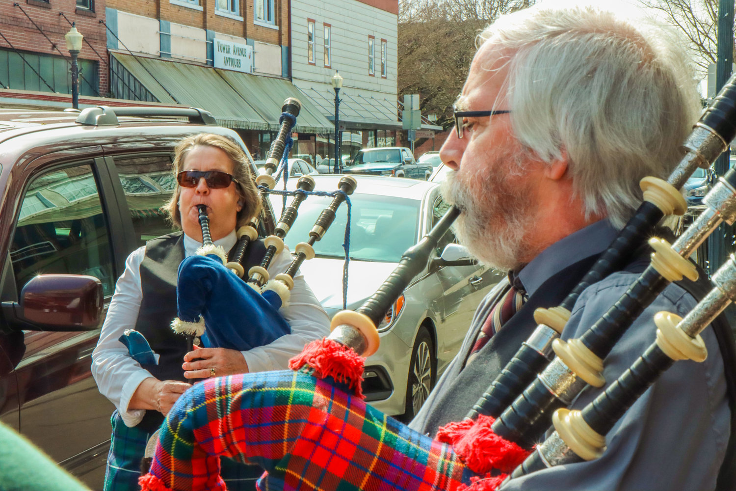 Anne Hall and Colin Gemmell play bagpipes outside of O'Blarney's Irish Pub on St. Patrick's Day in Centralia.