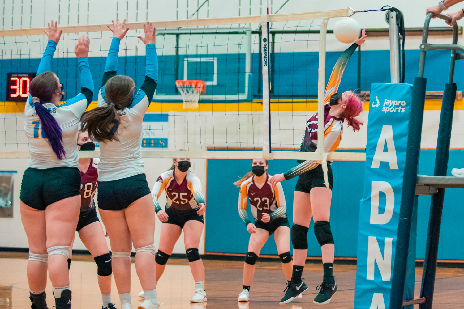 Winlock’s Reagan Lester (22) hits the ball over the net during a game against Adna on Wednesday.