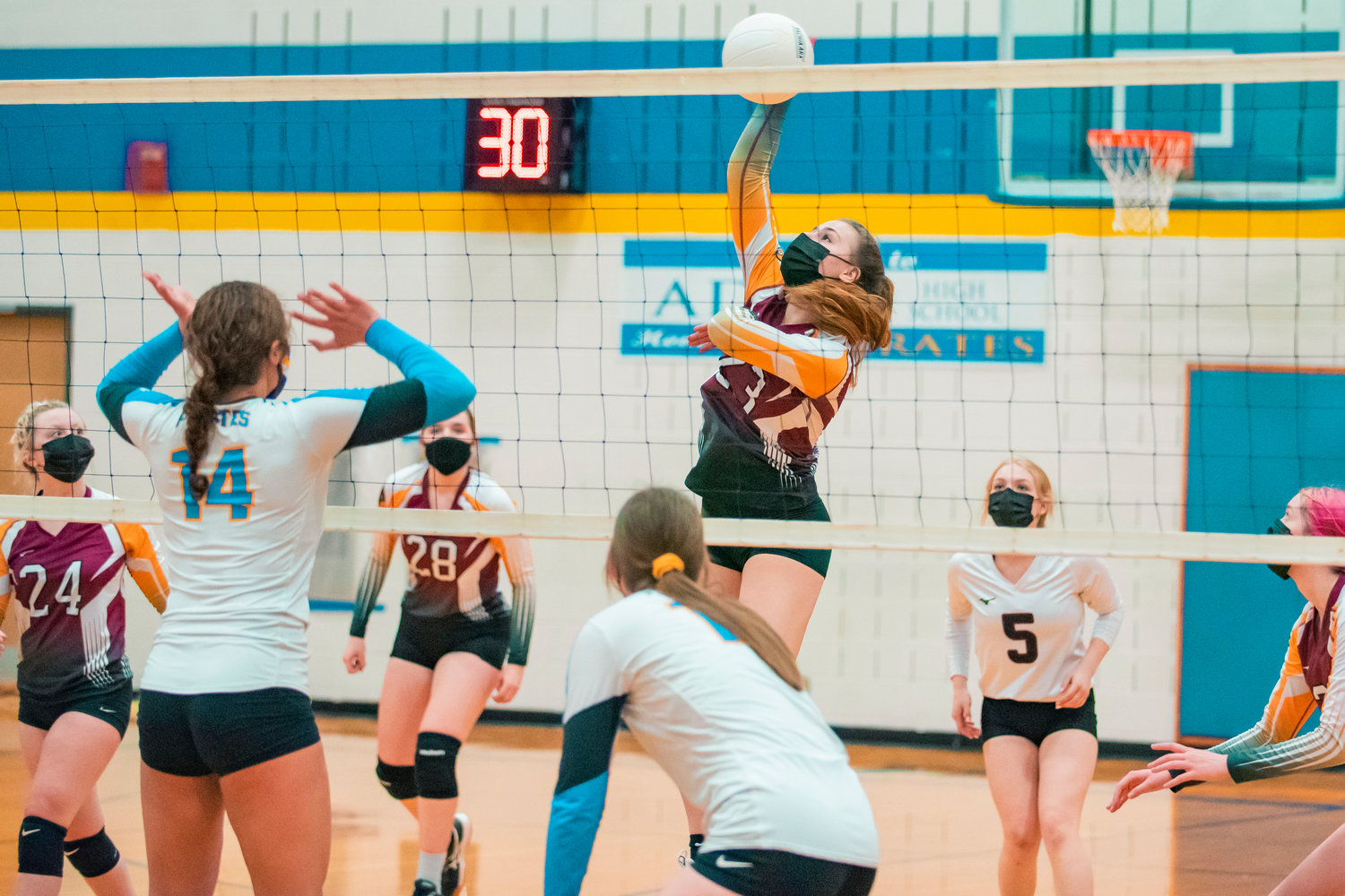 Winlock’s Karli Jones (23)  hits the ball over the net during a game against Adna on Wednesday.