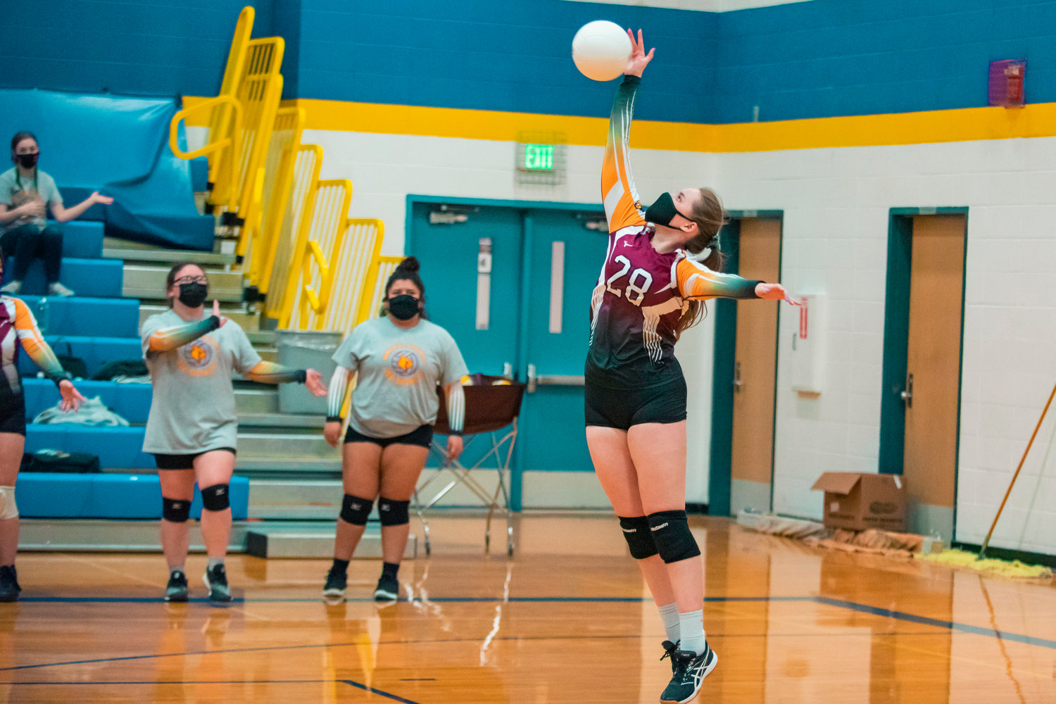 Winlock’s Madison Vigre (28) serves the ball during a game against Adna on Wednesday.