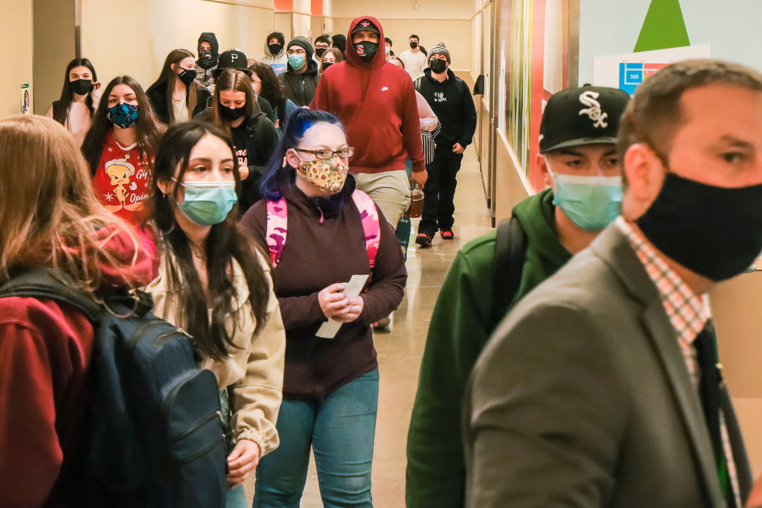 Students sport masks as they walk to their classes during their first week back in school Friday morning in Centralia High School.