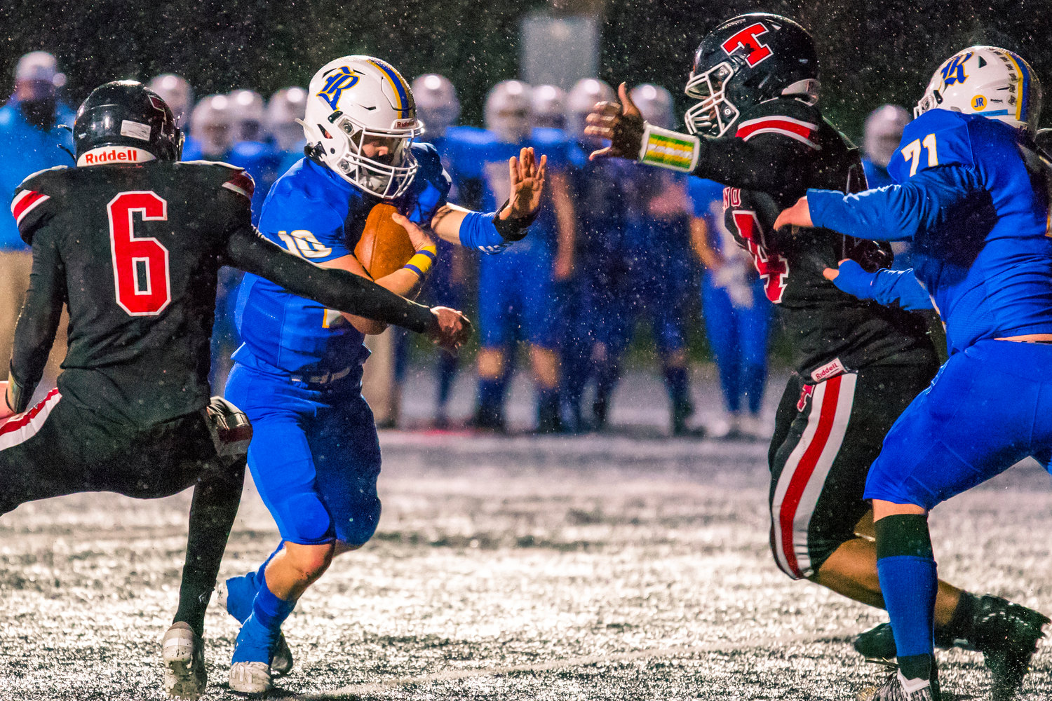 Beavers rush during a game against Rochester Friday night.