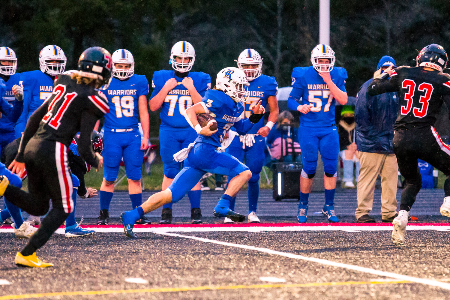 Rochester's Talon Betts (3) runs with the football during a game against Tenino Friday night.